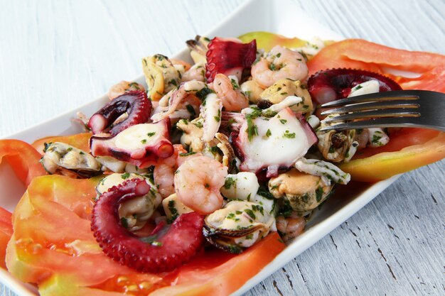 Seafood salad on wooden table