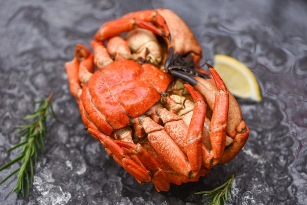 Seafood shellfish Steamed red crab or Boiled stone crab - Fresh crab with ingredients lemon rosemary