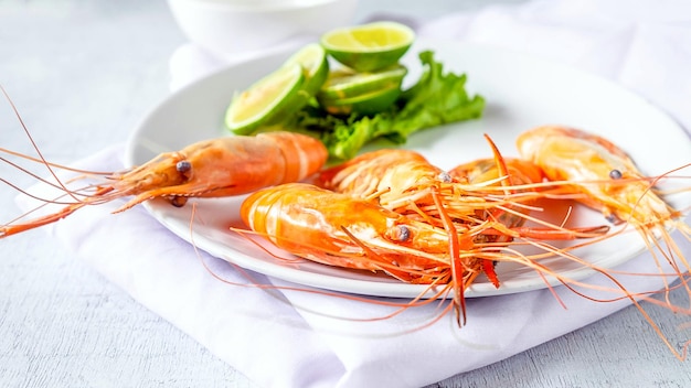 Seafood shrimp menu in a plate on a white table