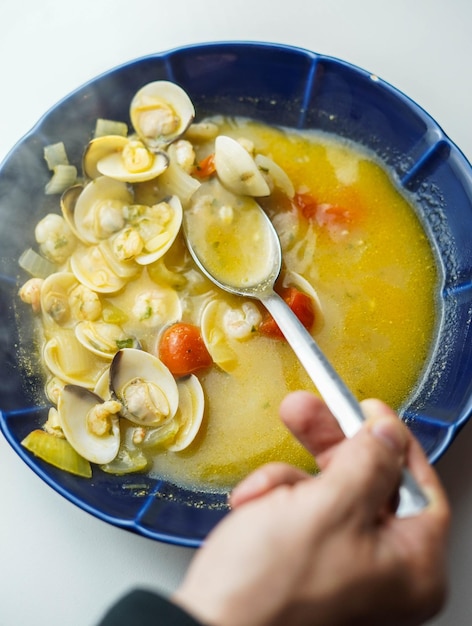 Seafood soup plate with clams and prawns