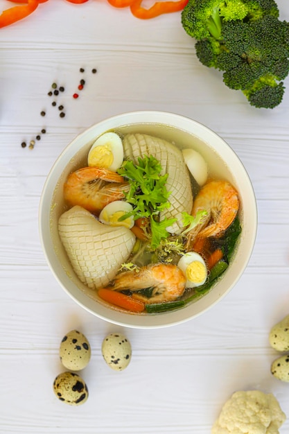 Seafood soup with squid shrimp and boiled egg diet food