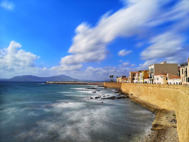 Seafront with coloured houses alghero sardinia italy