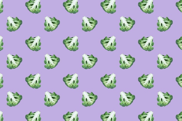 Seamles regular pattern with broccoli cut in half on a lilac background