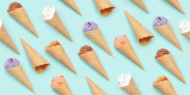 Seamless background with various ice cream over blue backdrop Flat lay