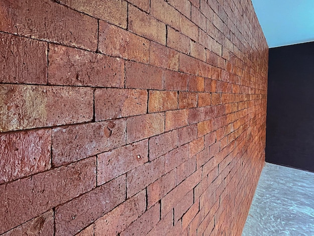 Foto struttura del muro di mattoni rossi senza cuciture del modello del mattone per lo sfondo