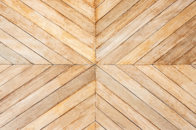 中央に矢印またはシェブロンパターンのシームレスな茶色の木材。上面図