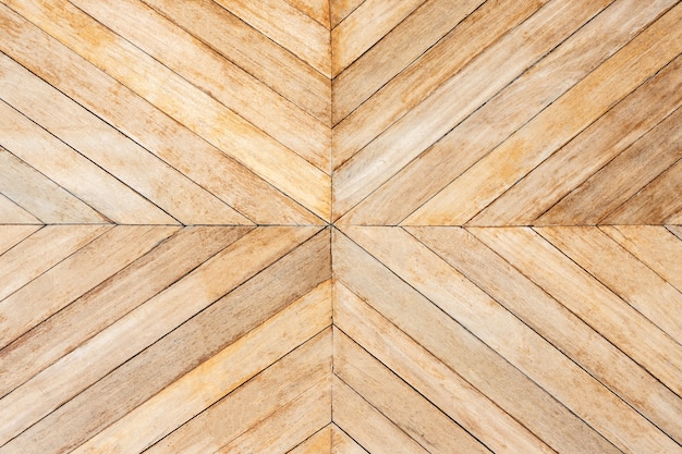 Seamless brown color lumber in arrows or chevron pattern to the center. top view