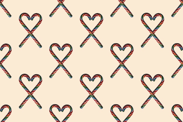 Seamless heart shapes with Christmas candies on trendy 2021 Sail Champagne background, top view. Can be used as decorative elements for Christmas and New Year, Valentine's Day.