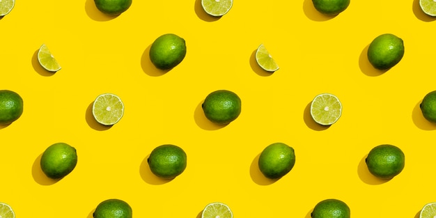 Seamless pattern from limes on a yellow background