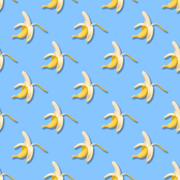 Photo seamless pattern with banana. abstract blue background