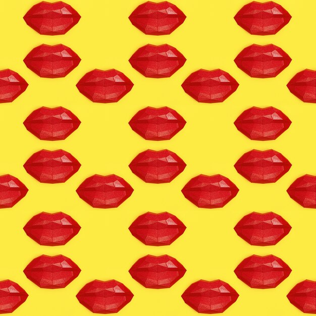 Seamless pattern with bright beauty red polygonal paper lips