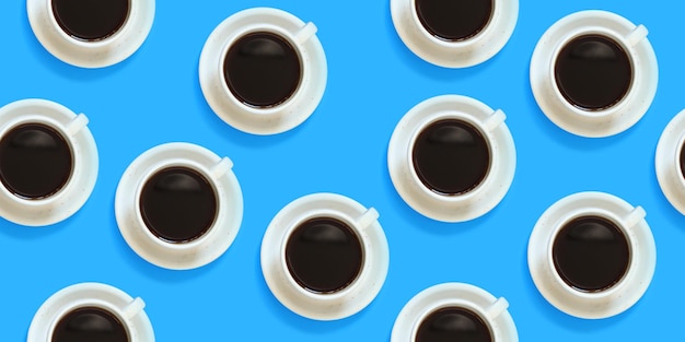 Seamless pattern with coffee cups on a blue background Pattern of white cups of coffee on saucers