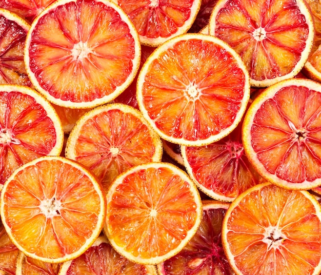 Seamless pattern with red Sicilian oranges Top view