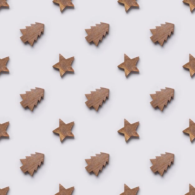 Seamless pattern of wooden Christmas tree and stars toys