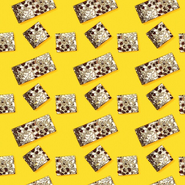 seamless regular creative pattern with bitten chocolate bar whole and broken into two parts