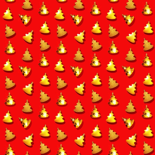 Seamless regular creative pattern with golden Christmas tree toys on red New Year background