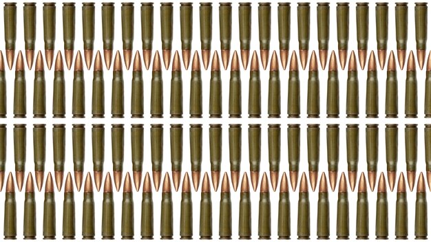 Seamless texture of bullets isolated on white background  mm cartridges for a kalashnikov assault rifle