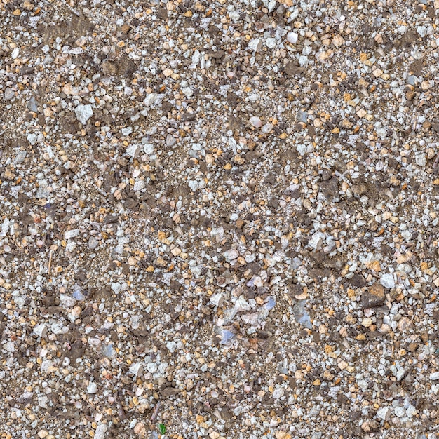 Foto seamless texture di frammento di terreno mescolato con ghiaia, macadam, pezzi di coquina e vetro.