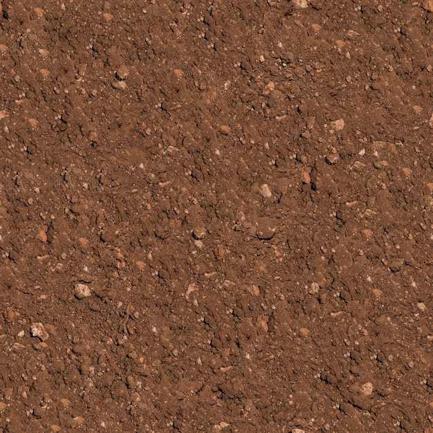 Foto seamless texture piastrellabile di terreno arato marrone