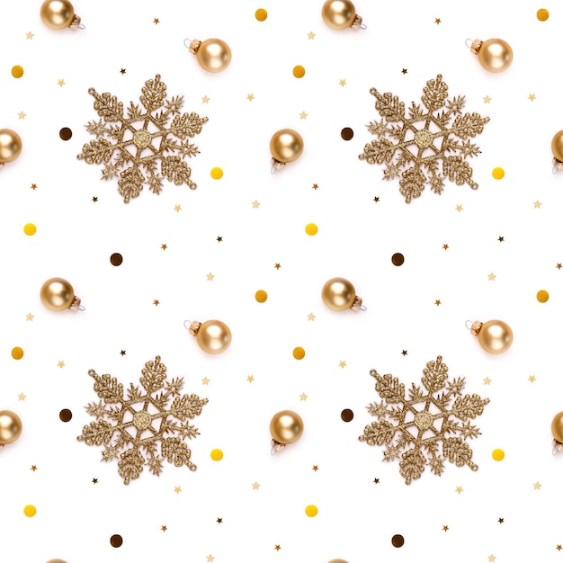 Seamless white New Year's Eve background with gold snowflakes, decorative balls, shining stars and shiny confetti