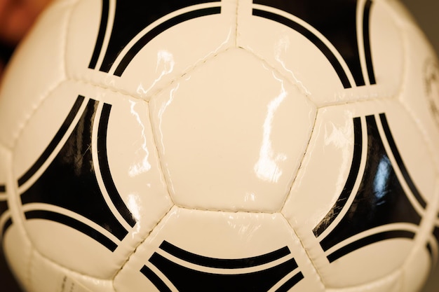 Seams of a black and white soccer ball closeup