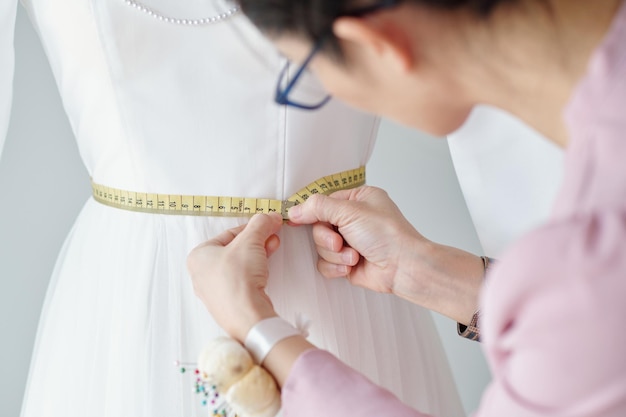 Seamstress Checking Waist Length