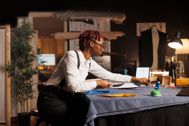 Photo seamstress doing measurements in studio