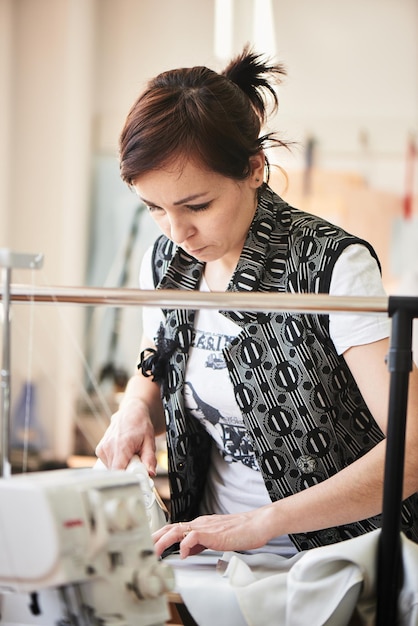 The seamstress ironed clothes on an Ironing Board in the Studio