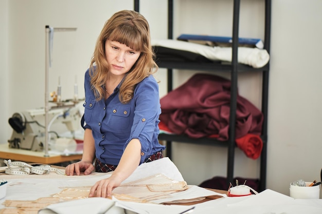 Seamstress in the process of clothing in the Studio