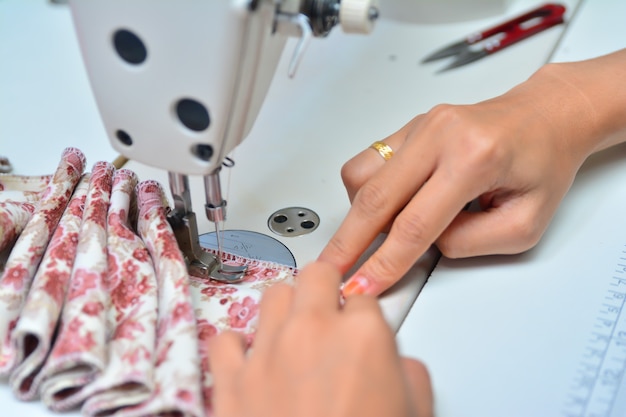 Seamstress working on sewing machine