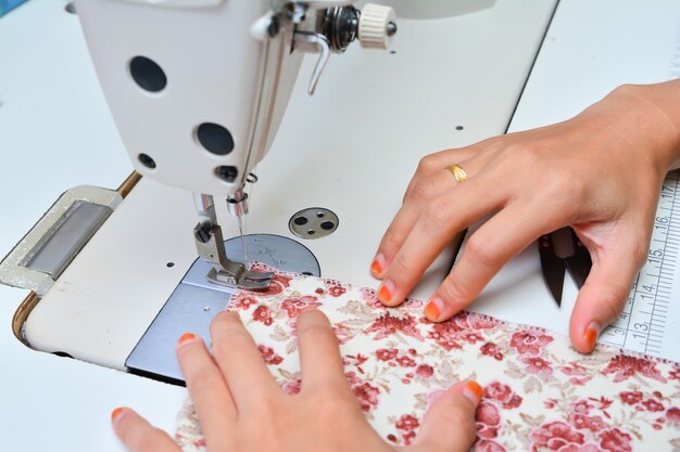 Seamstress working on sewing machine