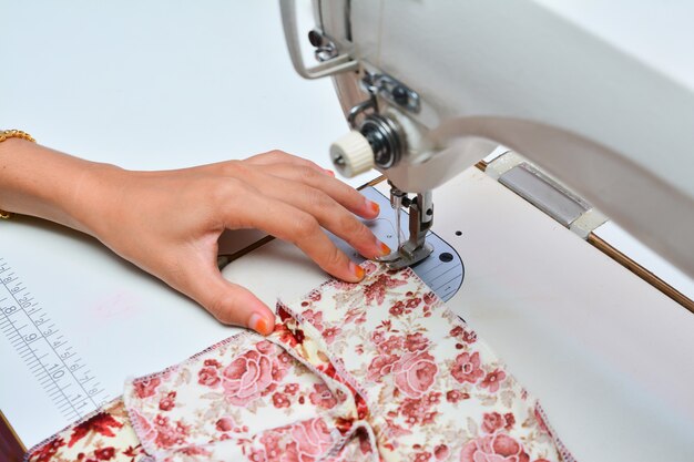 Seamstress working on sewing machine