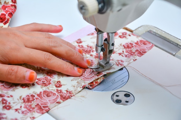 Seamstress working on sewing machine