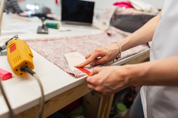 Seamstress works in the studio