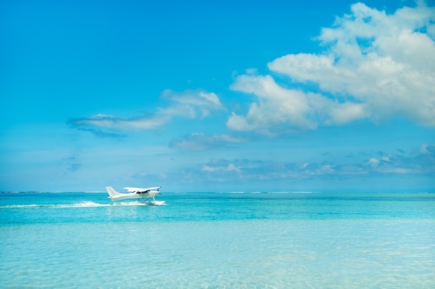 Seaplane begins to take off on the island of Mauritius in the Indian Ocean.