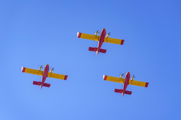 Seaplanes to put out forest fires flying in formation in a military parade