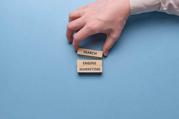 Search engine marketing SEM on wooden blocks.