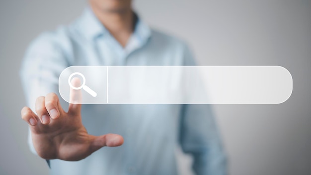 Searching Browsing Internet Data Information with blank search bar. man's hands are using a computer keyboard to Searching for information. Using Search Console with your website.