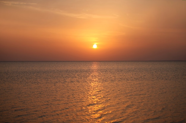 Seascape sea and sky at dawn in the rays of the golden sun