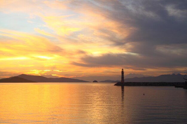 Seascape at sunshine Lighthouse and sailings on the coast Seaside town of Turgutreis and spectacular sunshine