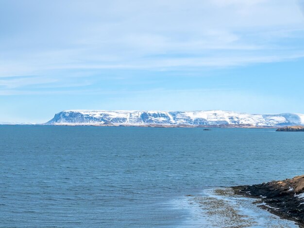 Seascape view from church hill at viewpoint of Stykkisholmur city under cloudy blue sky Iceland