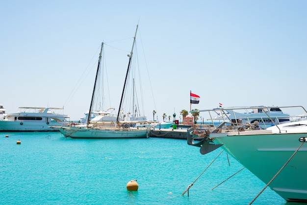 Seascape with parking and anchored boats and ships.