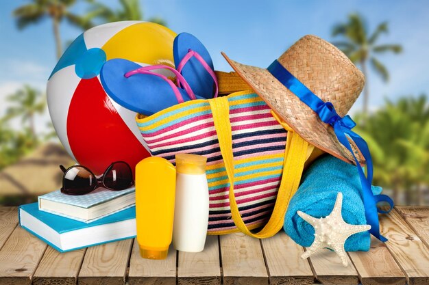 Seashell and flip-flop on blue towel background. Travel concept