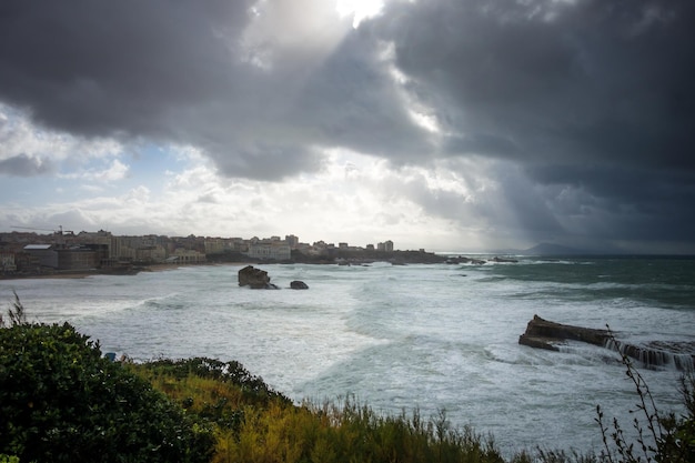 Seaside and beach of the city of Biarritz during a storm. panoramic landscape