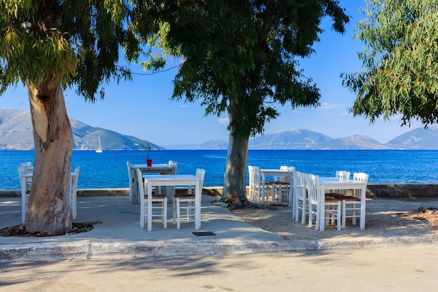 Seaside cafe with beach and sea background. Greece, Mediterranean