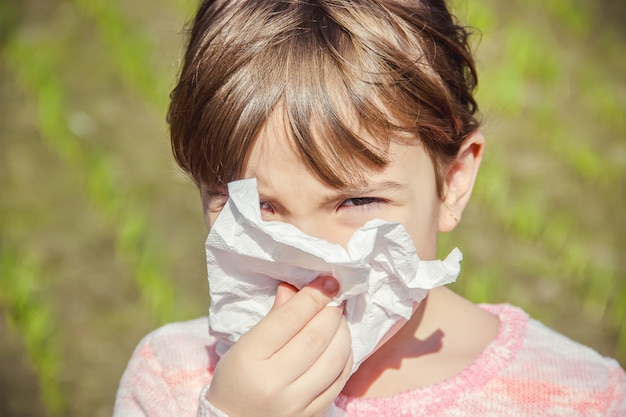 Seasonal allergy in a child. Coryza. Selective focus.