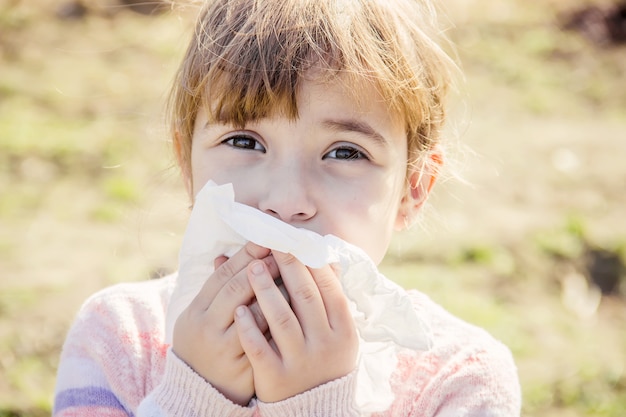 Seasonal allergy in a child. Coryza. Selective focus.