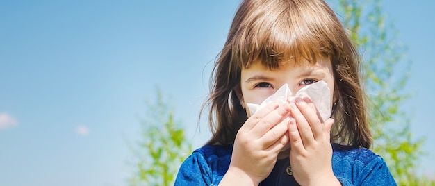 Seasonal allergy in a child. Coryza. Selective focus.