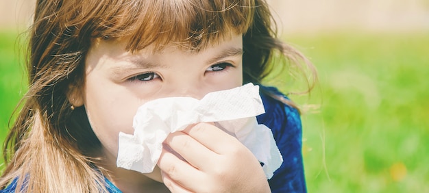 Seasonal allergy in a child. Coryza. Selective focus.