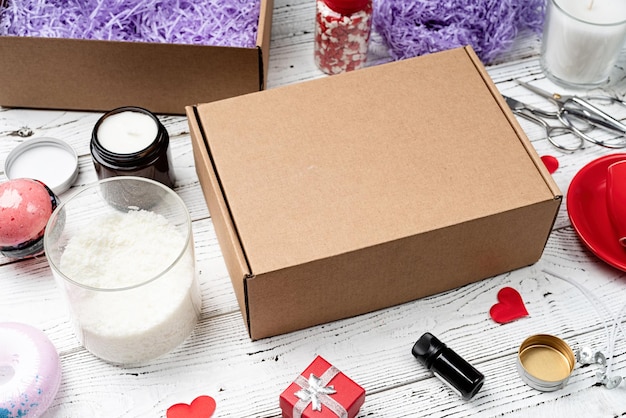 Seasonal gift box mockup for valentine day with candle red cup and heart shape sweets